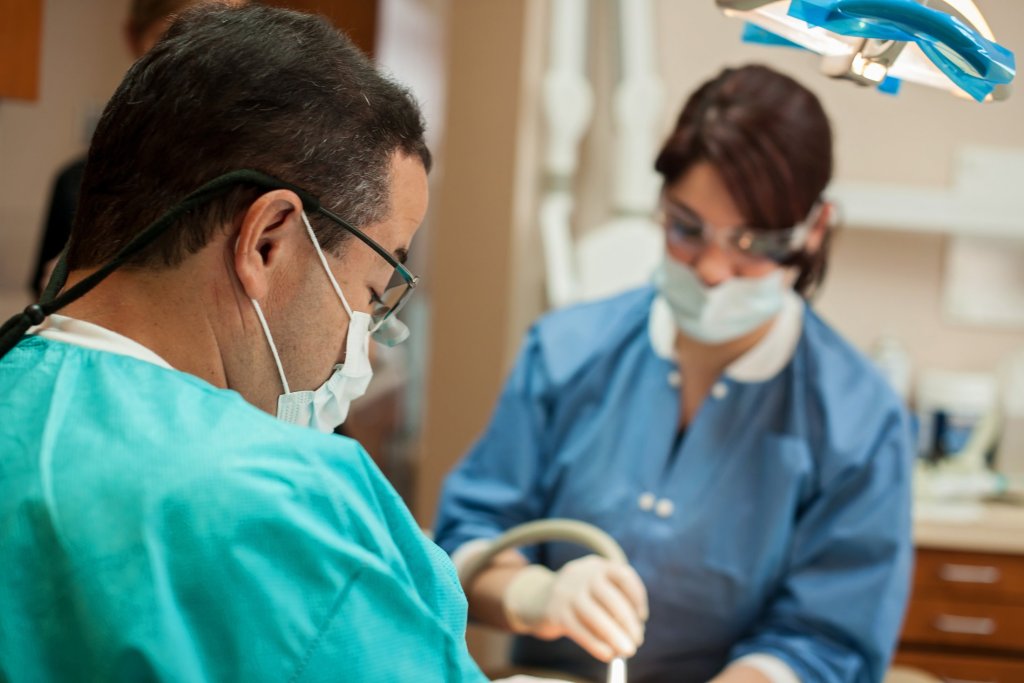 Dr. Bocanegra in scrubs practicing 