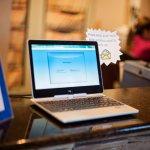 Laptop on counter of front desk at {PRACTICE_NAME}