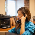 employee on phone smiling