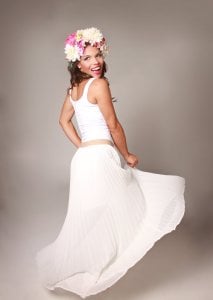 Woman twirling in a white dress